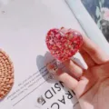 Macro detail of heart-shaped retractable badge reel with red glitter and sequins - Glitter Sequin Heart (No. 8)