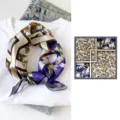 Silk small square scarf detail showing geometric floral print and elegant purple and yellow colors. - Purple Iris