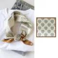 Silk square scarf featuring an elegant green tree leaf print and stylish brown border for women. - Leafy Tree