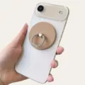 Close-up of beige matte magnetic phone ring holder attached to a white smartphone back - Magnetic Stand / Coffee