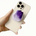 Detail shot of purple imitation crystal acrylic phone grip attached to a cream smartphone - Magnetic Stand / Purple Gradient