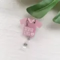 Close-up detail of a pink glitter nurse scrub badge reel featuring Scrub Life text. - Pink Nurse Uniform Badge Reel
