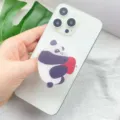 Close-up detail of cute panda acrylic telescopic phone grip on a white smartphone - Expanding Stand / Panda Holding Heart Style (2)
