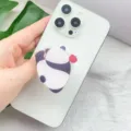 Close-up view of a cute panda acrylic retractable phone grip on a white smartphone - Expanding Stand / Panda Back View Style (1)