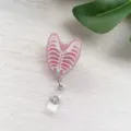 Detail view of pink glitter ribcage retractable badge reel for nurse identification - Heart Badge Reel