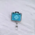 Gedetailleerde weergave van een blauwe acryl badgehouder met vloeibaar zand en glitters - EHBO-doos