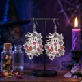 Detailed macro view of Halloween ghost acrylic earrings with floral and spiderweb prints - Floral Spider Web Ghost (WEH3548)