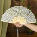 Elegant traditional Chinese style folding fan featuring intricate bird and floral pattern detail - Birds and Fallen Flowers