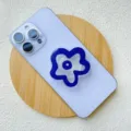 Blue and white flower-shaped acrylic collapsible phone grip on light purple smartphone - Support / Purple Flower
