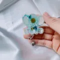 Cute elephant retractable badge reel with real blue dried flowers in resin detail - Blue Chrysanthemum Elephant Badge Reel