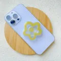 Chic yellow flower acrylic expandable phone grip stand on a light purple smartphone - Support / Earth Yellow Flower