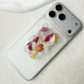 Close-up detail of 3D bear-shaped phone grip with real dried flowers on silver smartphone - Adhesive / Rose Bear