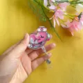 Detailed view of a pink heart cartoon nurse shaker badge reel with retractable clip - Nurse Heart Style
