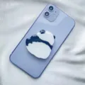 Cute minimalist panda acrylic phone socket grip stand attached to a purple smartphone - Expanding Stand / Backed Panda