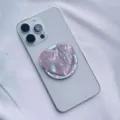Close-up of heart-shaped phone grip with iridescent pink shell pattern - Heart Magnetic Holder / Purple Scallop Shell