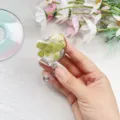 Detailed view of heart-shaped retractable badge reel with real dried four-leaf clover - Heart Real Flower Badge Reel 3