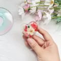 Close-up macro view of heart-shaped retractable badge reel containing real dried flowers - Heart Real Flower Badge Reel 2