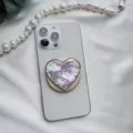 Macro detail of heart-shaped phone socket with iridescent mother-of-pearl texture - Heart-Shaped Stand / Purple Scallop Shell Gold Base Magnetic - Heart Shaped