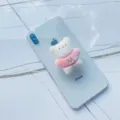 Close-up of cute white plush bear phone grip with pink sweater on a smartphone - Expanding Stand / M Pink Bear