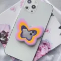 Vibrant multi-layer silicone butterfly phone grip with mirror detail on a white smartphone - Butterfly Airbag Stand / Purple