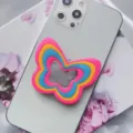 Detailed view of layered colorful silicone butterfly phone grip with mirror finish - Butterfly Airbag Stand / Pink