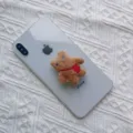 Cute brown plush bear retractable phone socket stand attached to a white smartphone - Expanding Stand / Brown Backpack Bear