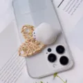 Detailed close-up of a cute white bird-shaped squishy phone grip on a clear case - White Seal Style