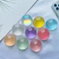 Collezione di nove impugnature per telefono a sfera di cristallo su seta bianca - Supporto a gonfiabile / Sfera di Cristallo Gialla