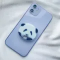 Close-up of cute panda face acrylic expandable phone socket on purple smartphone - Expanding Stand / Panda Head Type 1