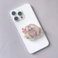Close-up detail of acrylic cartoon character pop socket stand on a white smartphone - Expandable Stand Style 10