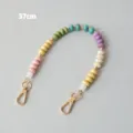 Close-up of a 37cm colorful acrylic bead strap with gold lobster clasps for bags - Color Block