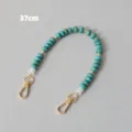 Close-up of 37cm turquoise acrylic beaded chain with golden metal lobster clasps - Turquoise