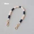 Detailed macro view of 38cm acrylic beaded chain strap with gold-toned metal lobster clasps - Flat Bead Style / 38cm Size / Beige Blue