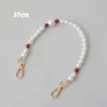 Macro view of 37cm acrylic pearl chain featuring red beads and gold metal clasps - 37cm / Red
