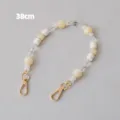Detail view of a 38cm acrylic bead chain featuring cream and transparent resin beads - 38cm / Beige