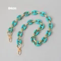 Detail view of turquoise marble resin pig nose chain strap with gold links, 84cm - 84cm / Turquoise