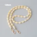 Detailopname van een crème acryl kralenketting met gouden sluitingen, 120 cm lengte - 120cm / Abrikoos