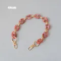 Detail view of 44cm pink marble resin chain strap with elegant gold metal clips - 44cm / Red