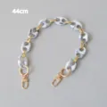 Detail view of marble-patterned resin bag chain with gold-toned swivel clasps - 44cm / Ink White