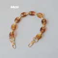 Close-up of 44cm retro amber resin pig nose chain strap with gold-tone metal clasps - 44cm / Amber