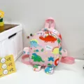 Cute pink cartoon dinosaur backpack for children featuring creative 3D limb design for school - Pink