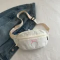 White Korean style fabric waist bag featuring a pink bow embroidery and adjustable strap - White