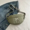 Casual olive green waist bag with white bow embroidery and gray adjustable strap for daily use - Green