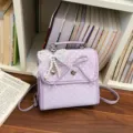 Sweet purple polka dot backpack with a decorative lace bow and pearl heart charm - With Pendant / Purple