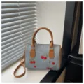 Denim handbag with cherry embroidery, tan leather handles and adjustable shoulder strap - Boston Style / Brown