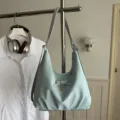 Stylish light blue hobo shoulder bag with elegant bow and silver heart pendant detail - Blue Without Pendant