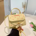 Chic cream polka dot handbag for girls with red fashion print and metal buckle - Yellow