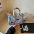 Blue denim Boston bag with red cherry embroidery and matching charm decoration - No Pendant / Khaki