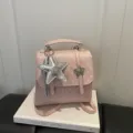 Stylish Korean style pink polka-dot mini backpack featuring silver star charms and handle - Pink with Charm