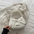 Witte handtas met zwarte stippen, strikdetail en schouderriem - Wit
